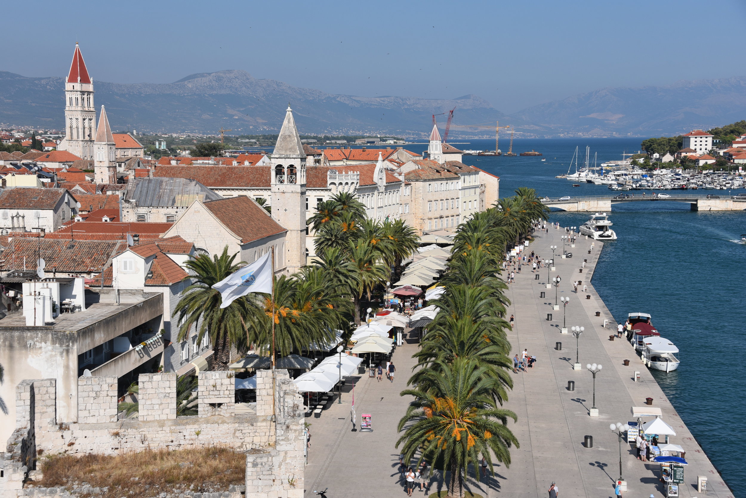 View from the fortress (see lower left for corner of fortress wall) at the end of the promenade in Trogir. I watched a few super-yachts dock alongside here for the evening out.