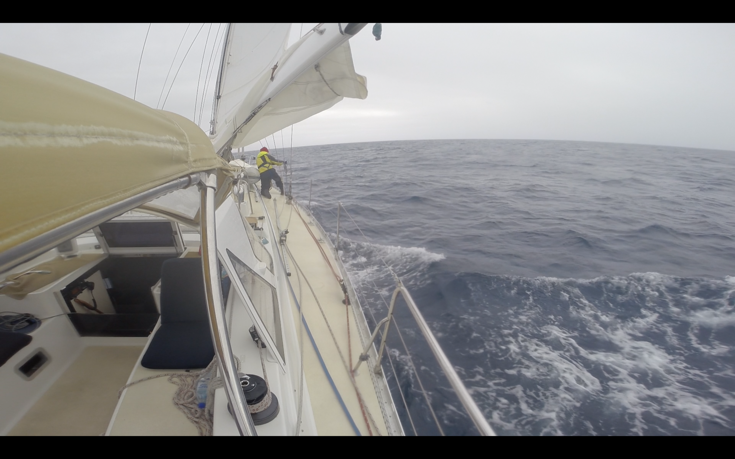 Running the preventer line from the end of the boom, around starboard side and bow, and down the port side.