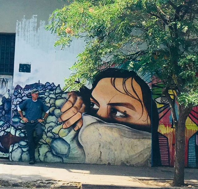 Admiring the mural-lined streets of Barrio Bellevista in Santiago.