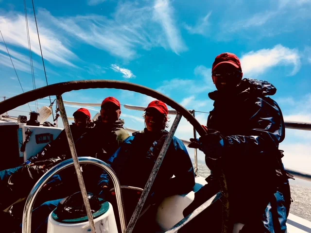 Darkened the photo to protect the innocent, but trust me, the group was all smiles during this team-building event on the SF Bay.
