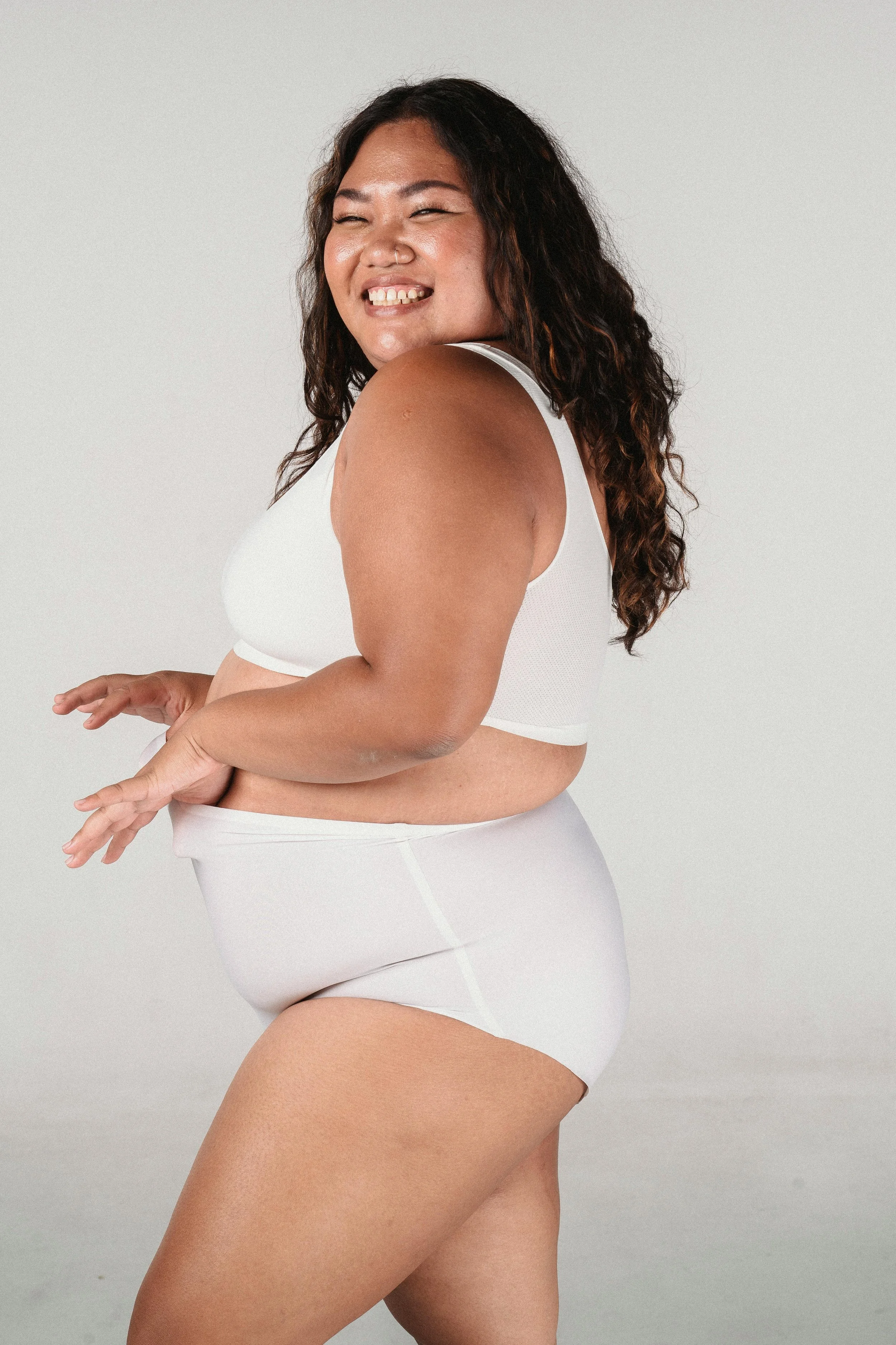 Plus size woman in underwear. Learning body confidence in Vancouver with a weight inclusive therapist.