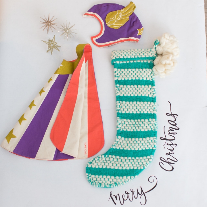 Styling by Mari Spiker, Cape and Helmet by Love Lane Designs, stocking by Anthropologie, calligraphy by Octavia Spiker