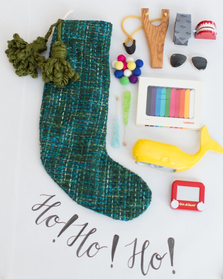 Styling by Mari Spiker, stocking by Tinsel, calligraphy by Octavia Spiker, sling shot set/ray-ban sunglasses/crayon set at Peek Kids, mini etchasketch/whale bank/chattering teeth by The Land of Nod, and tie by CrewCuts.