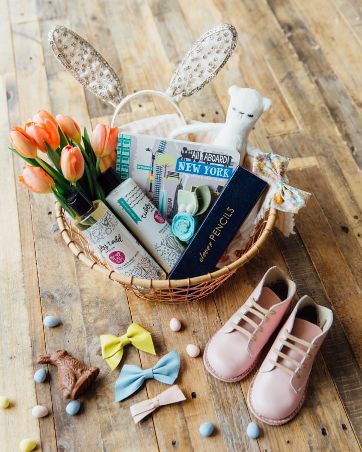 Wire Basket, Bunny Ears, Book, Pencil Box, and cloth napkins: Anthropologie , Shoes: Zimmerman Shoes , Leather Bows: Fourth and Pierce , Floral Fabric Bow: Zozu Baby , Bear: Commonfolk , Felt Headband: Fancy Free Finery , and Lotion/Bubble Bath: Tubby Todd