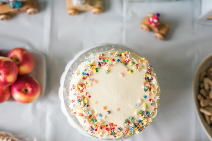 I think my favorite detail were the Alphabet sprinkles I found for his cake. I had a local bakery (Two Little Red Hens on the Upper East side--a must try!) make him a banana cake with cream cheese frosting) and I added the sprinkles myself. Aren't they just perfect? You can find them on Amazon! 