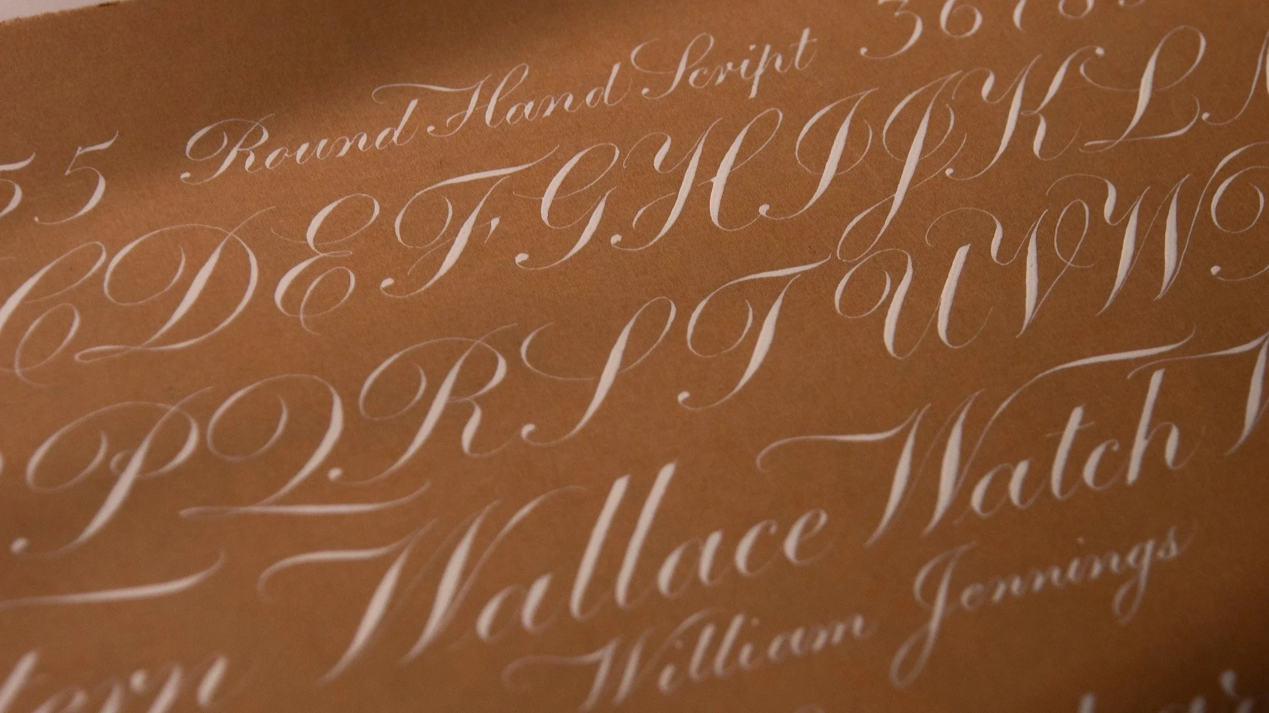 My copy of Ross F. George’s Round Hand Script (copperplate calligraphy) exemplar from the 13th edition of the Speedball Textbook, penned with a Hunt 101 nib and Dr. Ph. Martin’s bleedproof white ink on Fabriano Ingres paper