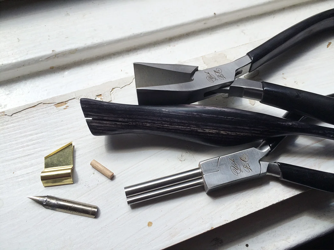 A flange is folded and fitted to hold a specific nib (if requested)