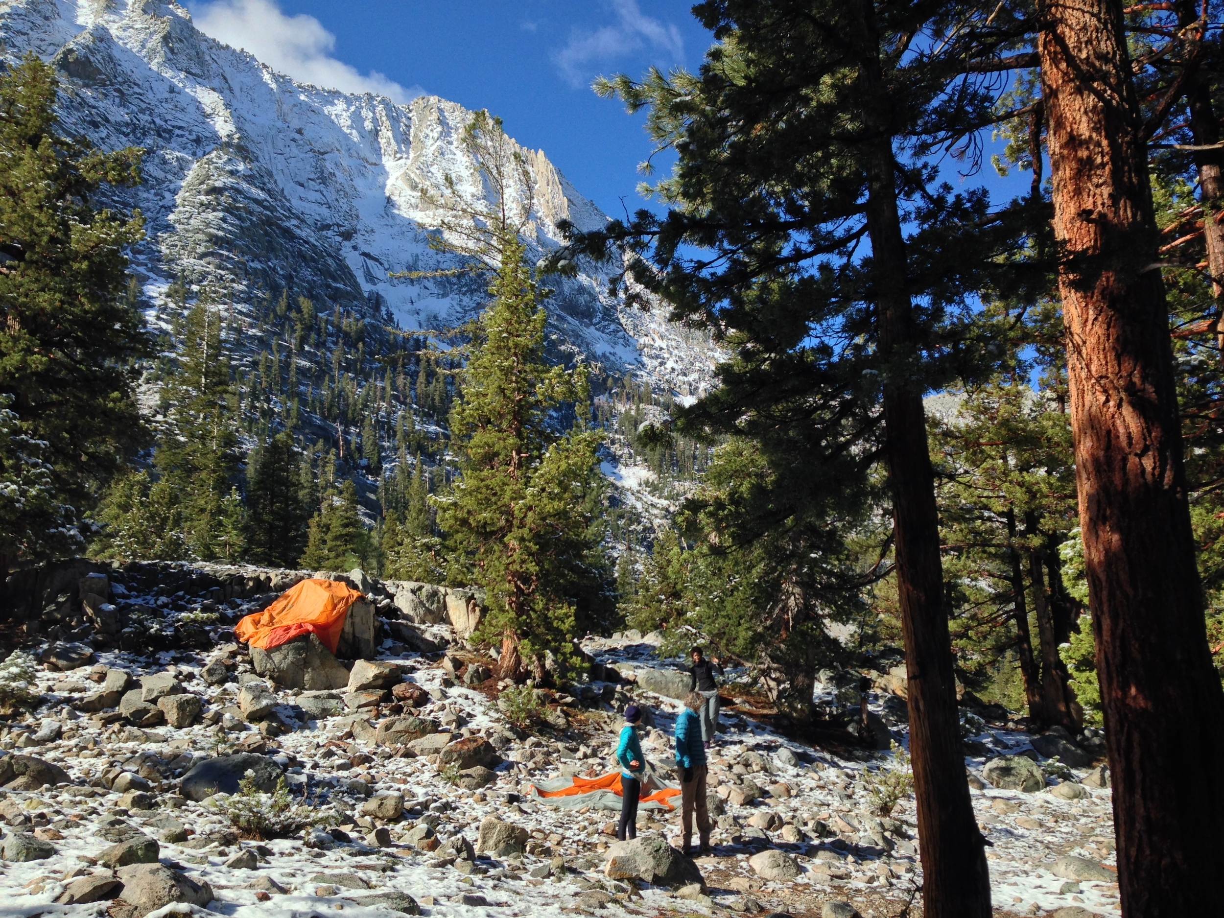 maya, tomas, and eva dry their kit out in the sunny morning