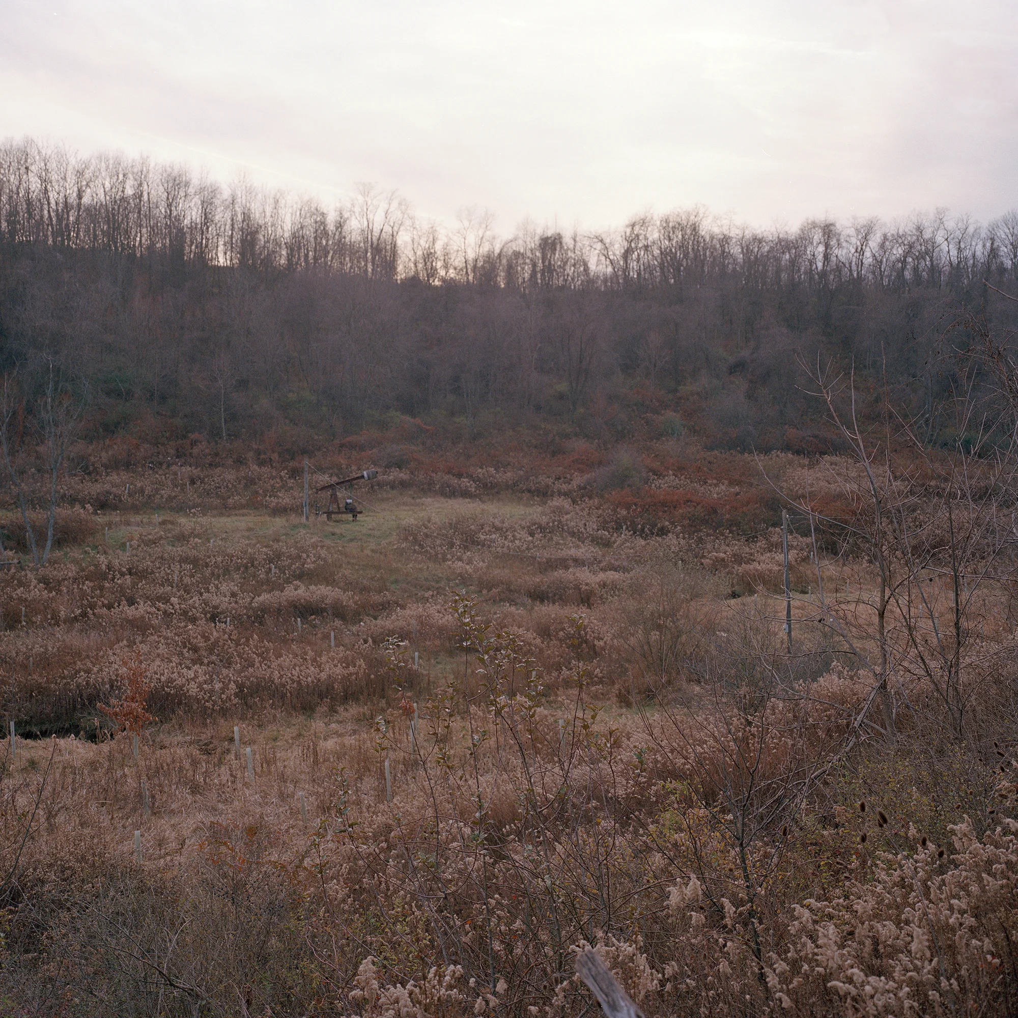 An abandoned natural gas rig in a field near Claysville PA