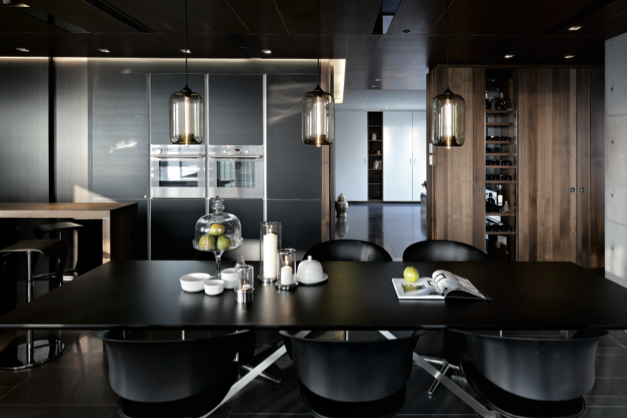 A dramatic black kitchen gets a touch of warmth from natural—but also dark—wood - LEICHT Küchen AG