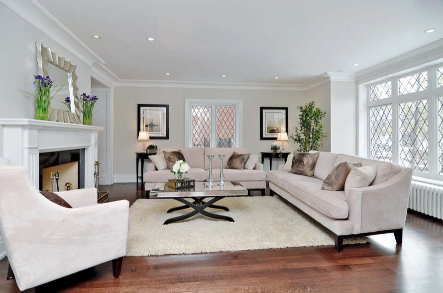 Neutral paint, contemporary furniture, and simple accents showcases this home's living room.