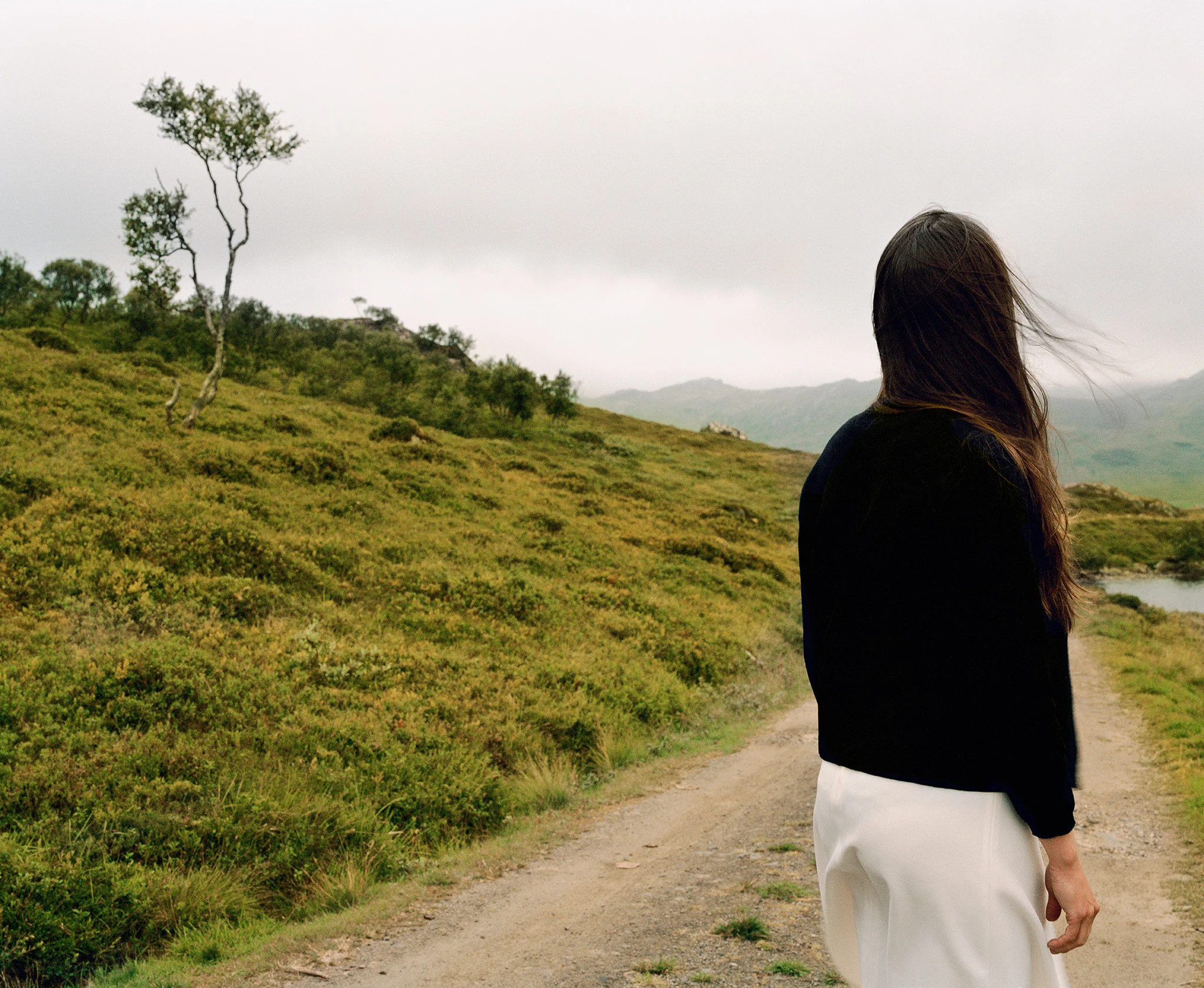 woman_on_gravelled_road_nygards_karin_bengtsson.jpg