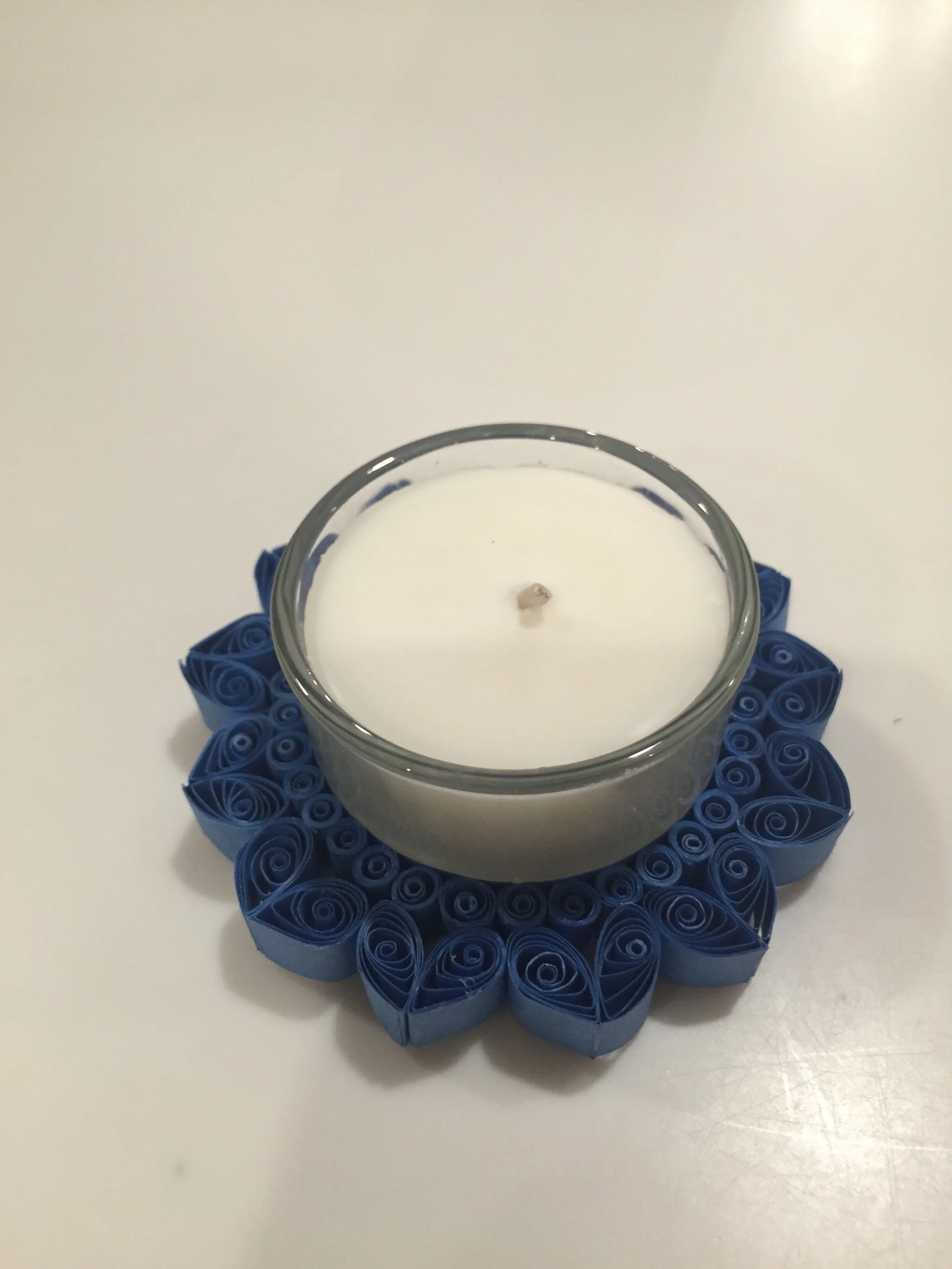 Here are two items. An unscented soy candle from IlluminationStudios on Etsy. They are located in seattle. I love that she got the candle from a small company. The Rangoli- inspired quilled candle holder is handmade in Colorado (yay for local businesses). It is amazing and I can't even imagine how one would make it. This is also from an Etsy seller ALatteJoy. I burned the candle with the holder attached with my dancing Ganesh at home. He enjoyed it. 