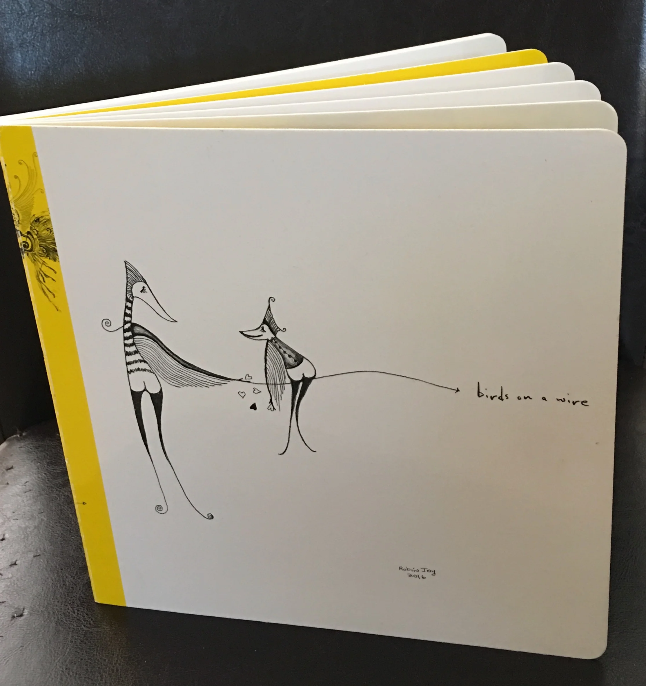 “Birds on a Wire” hard cover limited edition hand signed book
