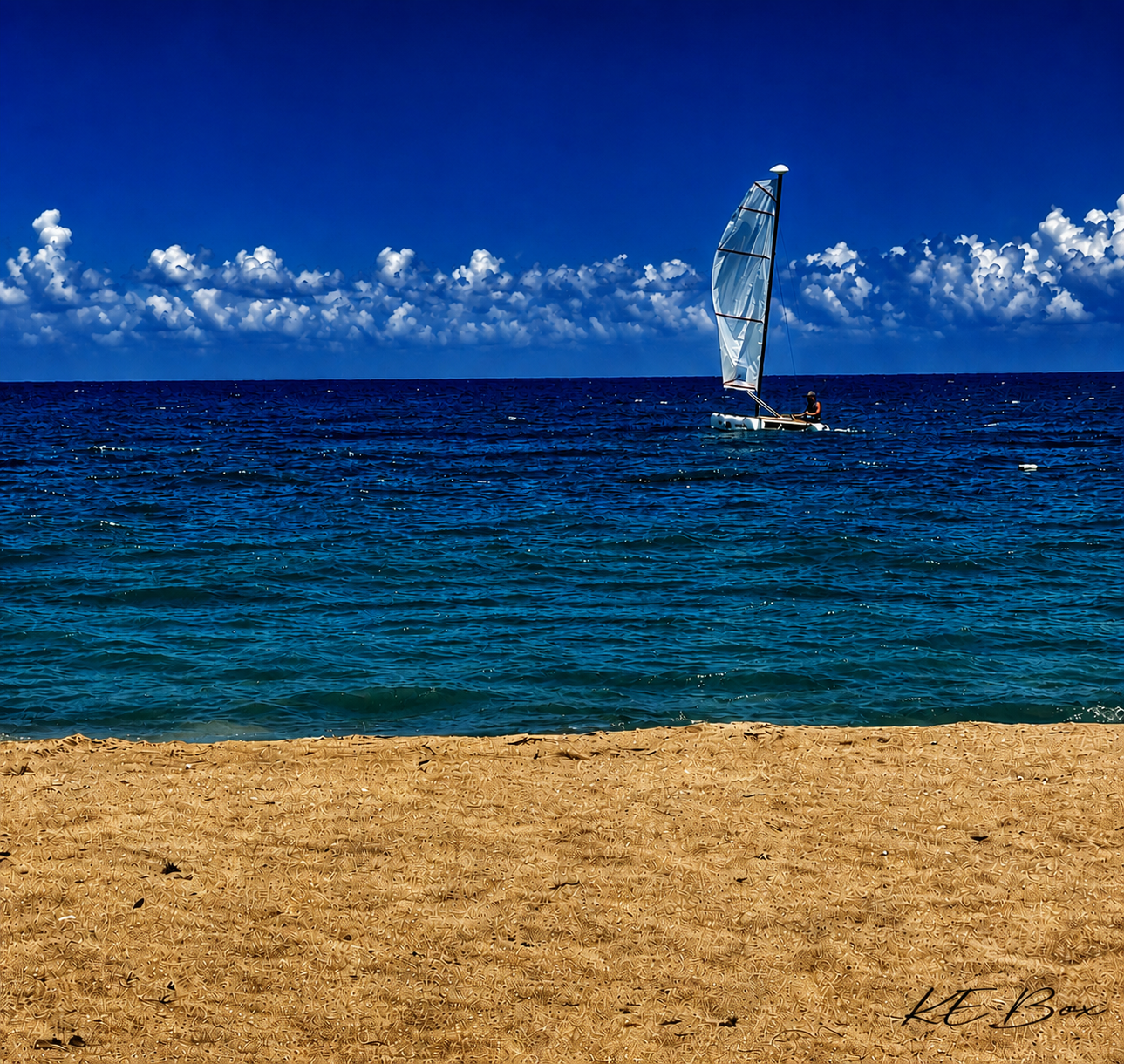 Sailboat Beneath Billowing Horizon Clouds.png