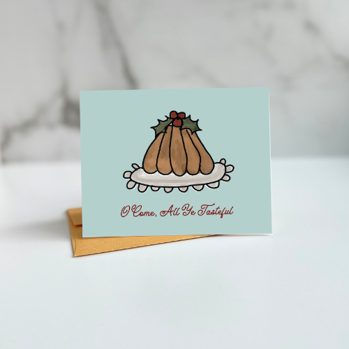 Figgy Pudding illustration folded card with text, "oh come all ye tasteful" designed by Viola and Beatrice Stationers