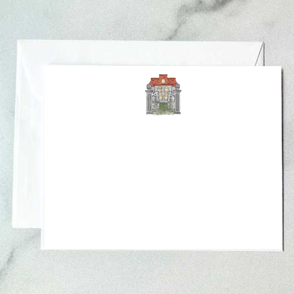 Illustrated Spanish gate note card featuring ornate iron scrollwork, stone columns, and a terracotta-roofed manor with glowing windows, designed by Viola and Beatrice Stationers