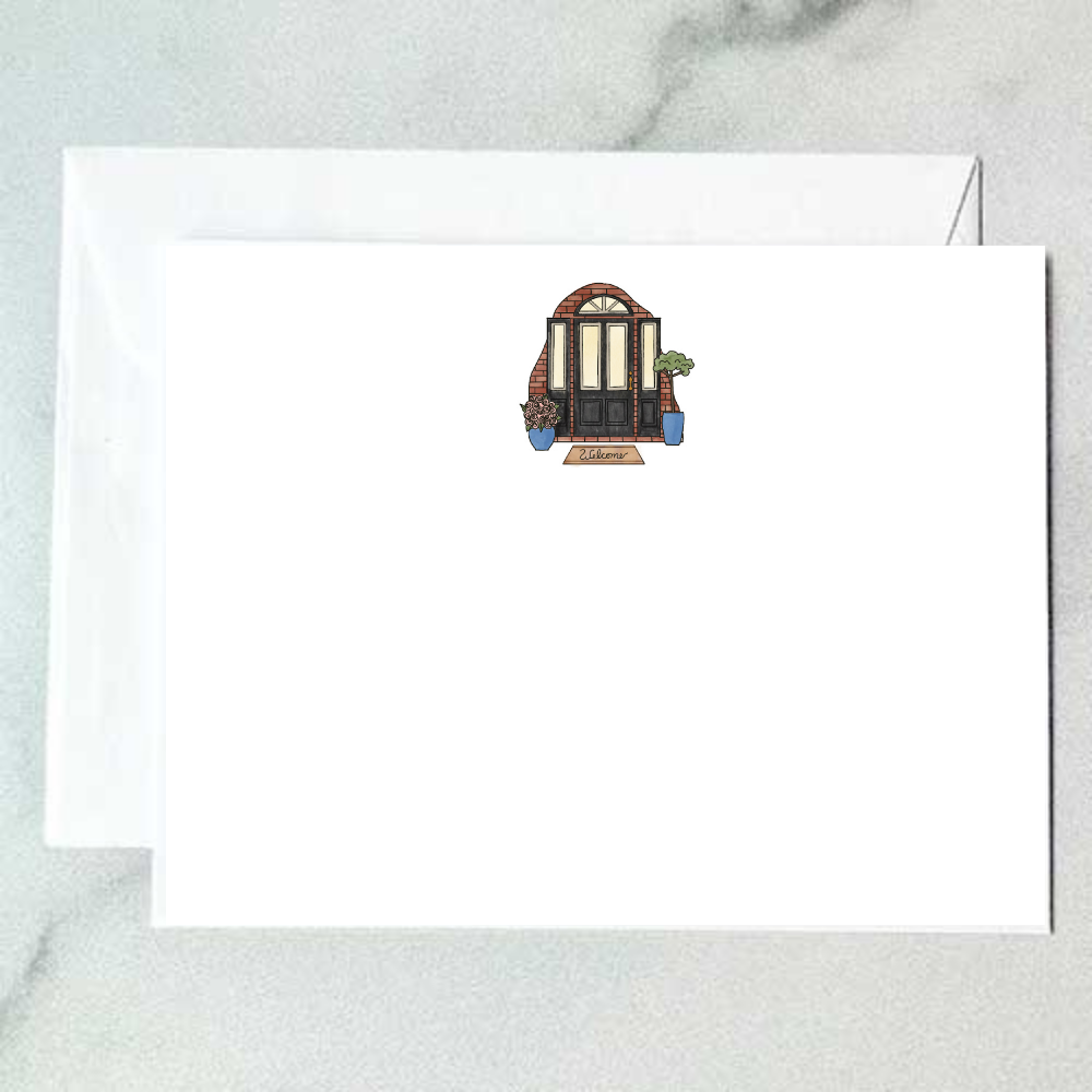 Illustrated brick door note card with black paneled door, blue planters, rose blooms, and welcome mat, designed by Viola and Beatrice Stationers