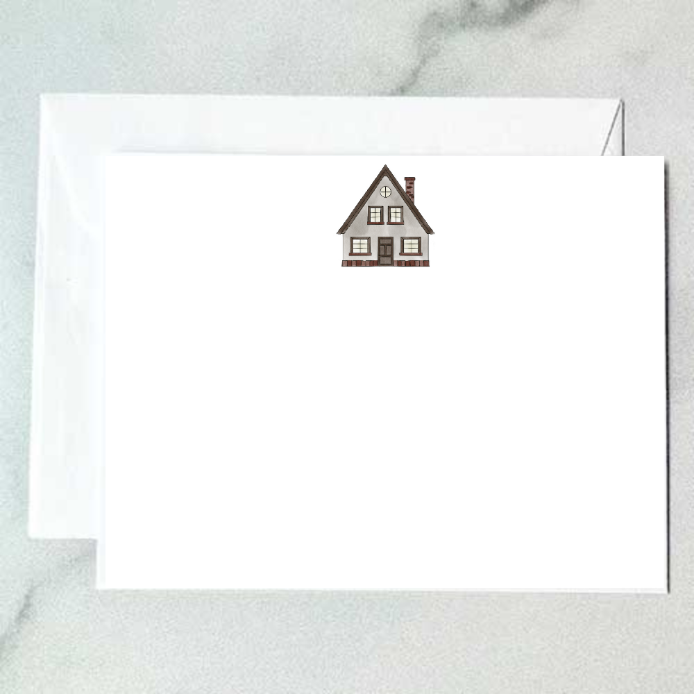 Illustrated A-frame house note card with steep roofline, brick chimney, and warm window glow, designed by Viola and Beatrice Stationers