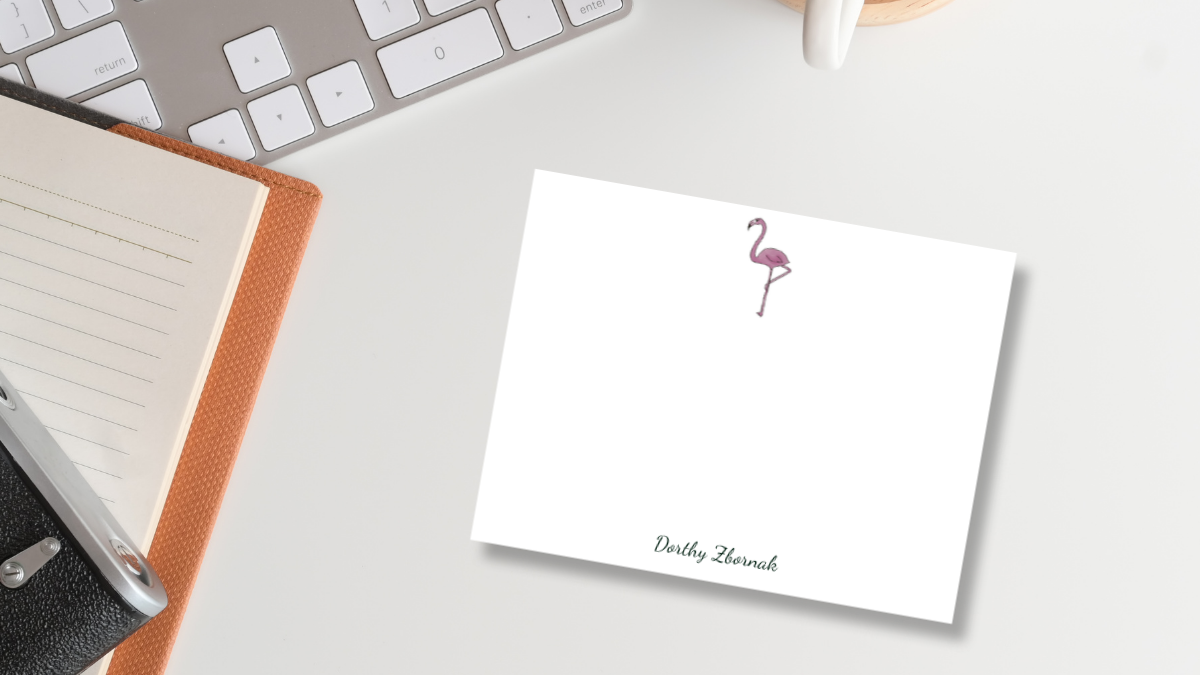 a note card with a pink flamingo illustration at the top center and a personalized name at the bottom. designed by Viola and Beatrice Stationers