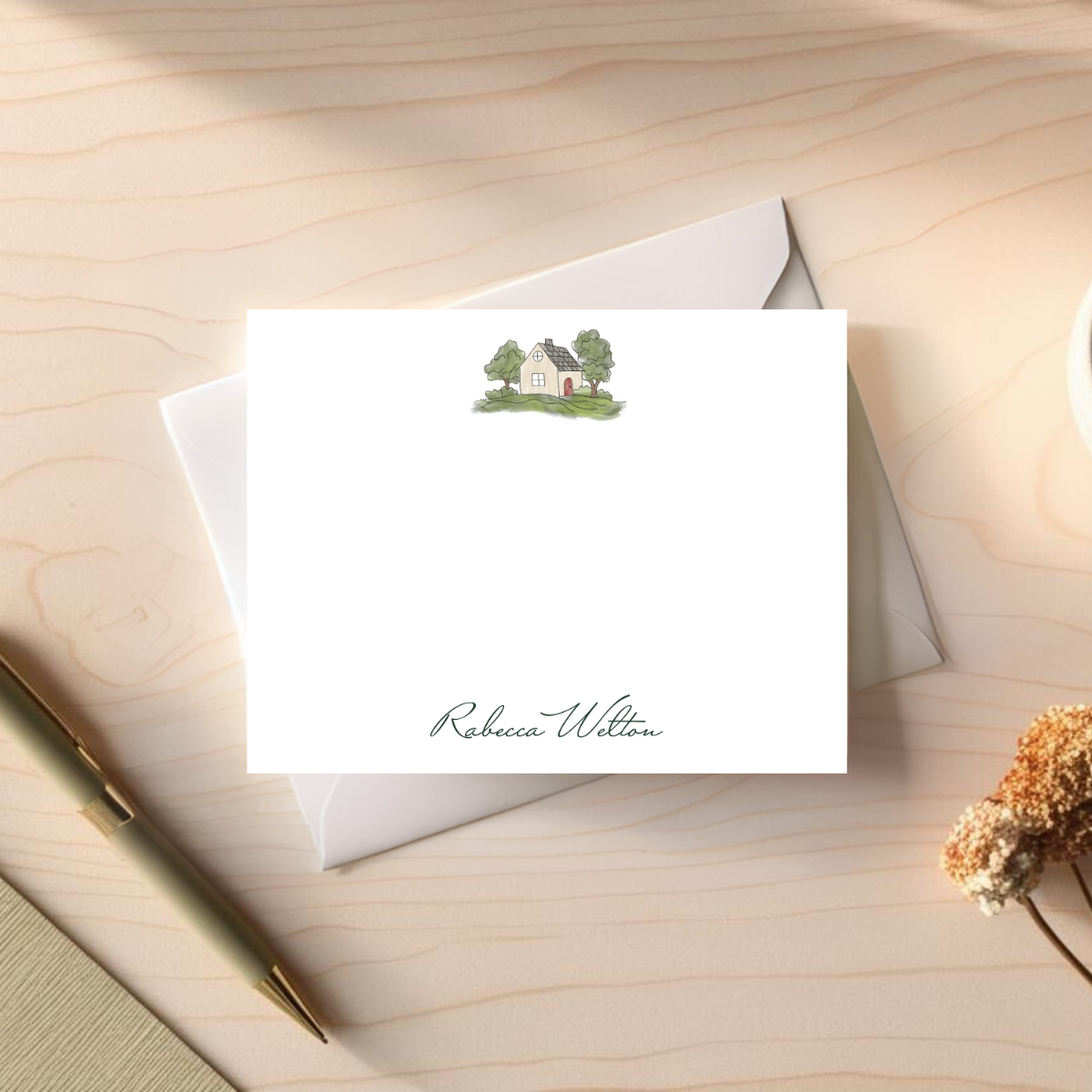 note card with a cottage and a personalized name at the bottom, Rebecca Welton designed by Viola and Beatrice Stationers