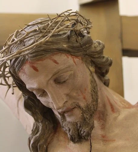 Photo of a statue, the face of Christ on the Cross bleeding from the Crown of Thorns