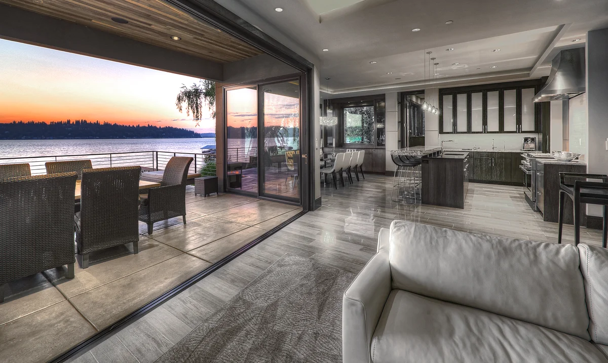 A 16 ft. LaCantina folding glass door opens from the Great Room to the water-facing outdoor covered dining area and deck.