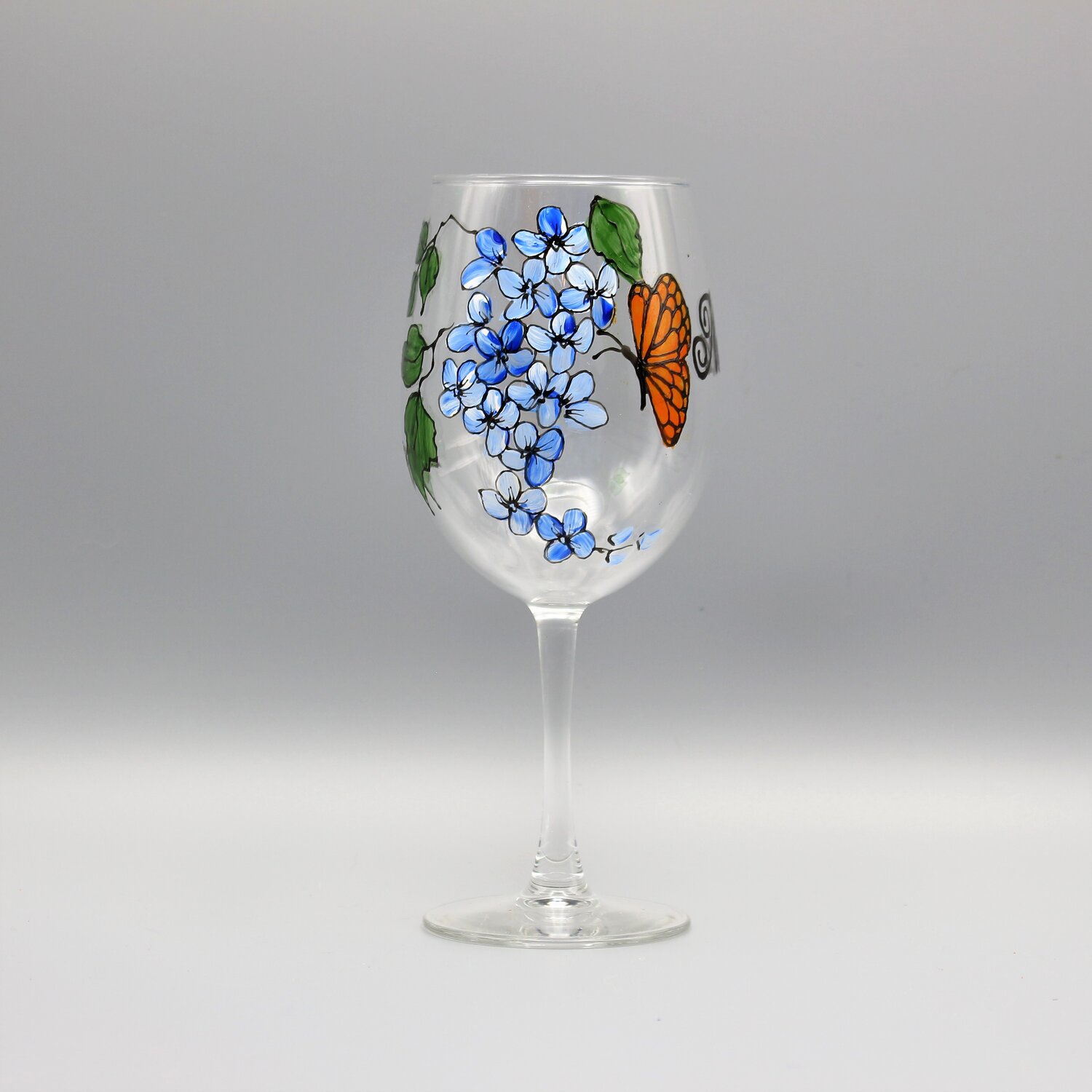 https://images.squarespace-cdn.com/content/v1/5570dc78e4b0bbe8e5cab3d0/1580176074241-I3URZ1ND56HY7ZYIP7JT/butterfly_and_flower_wine_glass_blue.JPG?format=1500w