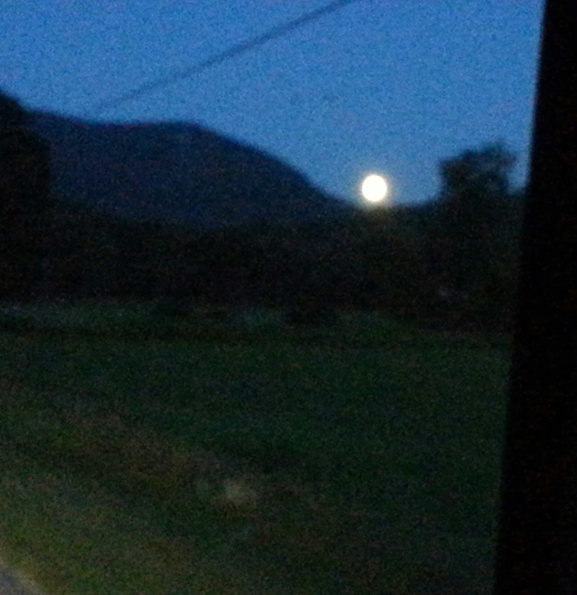 I know this is not the caliber of picture normally found here, but I wanted to give just a sense of of the wonder we felt when we saw this full, bright moon pop up right between those mountains out of nowhere!
