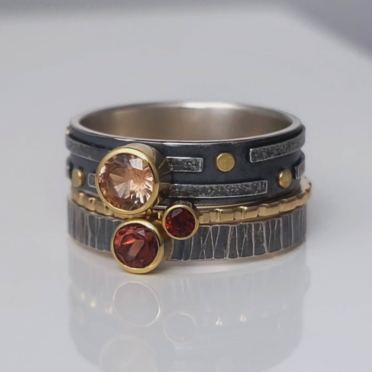 A new set of stack rings on their way to Oregon.  Sterling silver, 14k &amp; 18k gold with garnets and Oregon sunstone.

#oregonsunstone #artisanjewelry #mixedmetals #stackingrings #alaskaartist