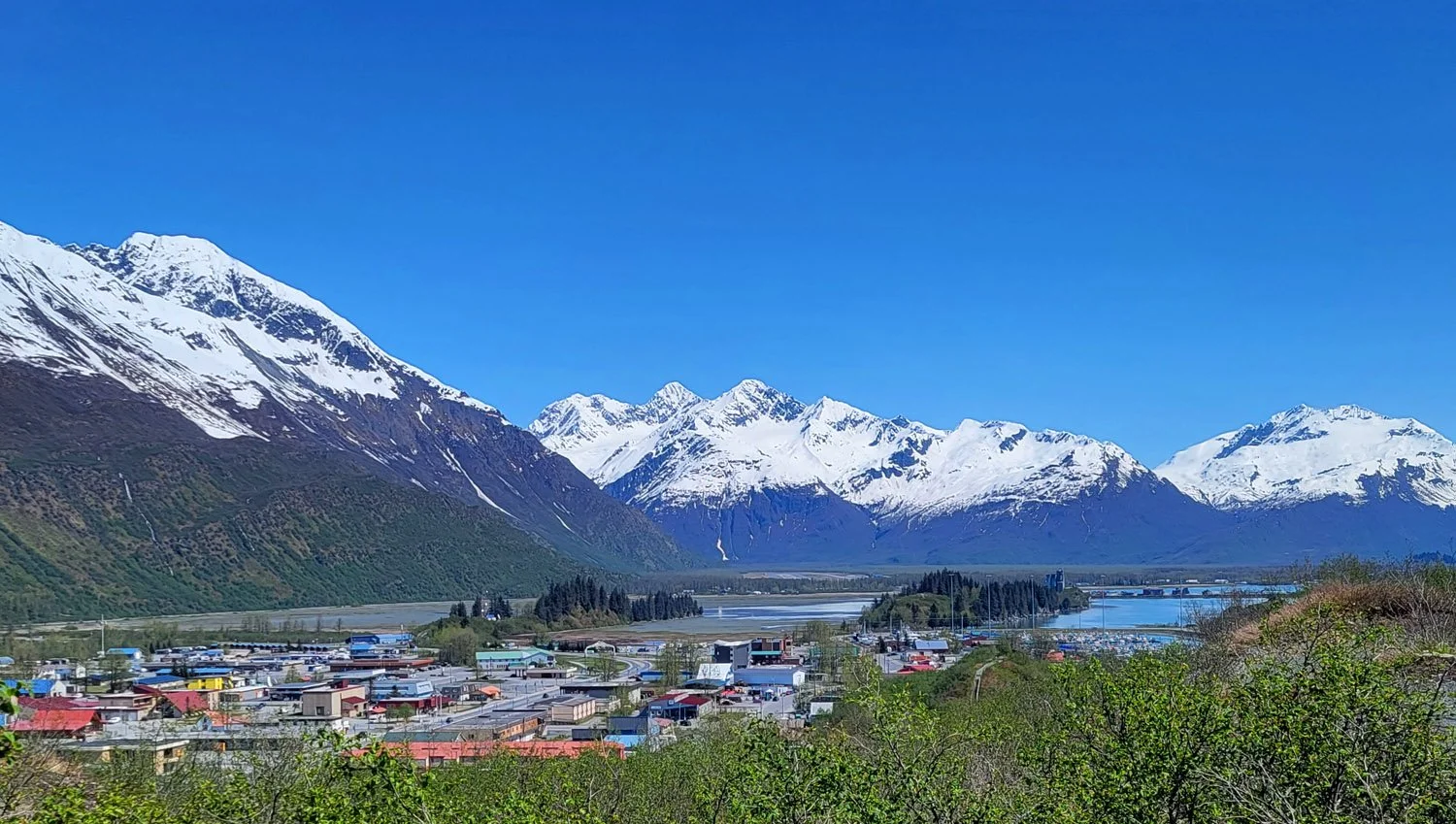 snow capped mountains overlooking waterfront in valdez alaska
