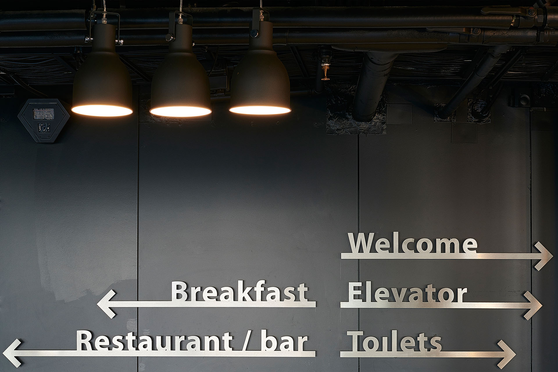 Signage / Water-cut stainless steel signage to match the industrial feel of Good Hotel Amsterdam.