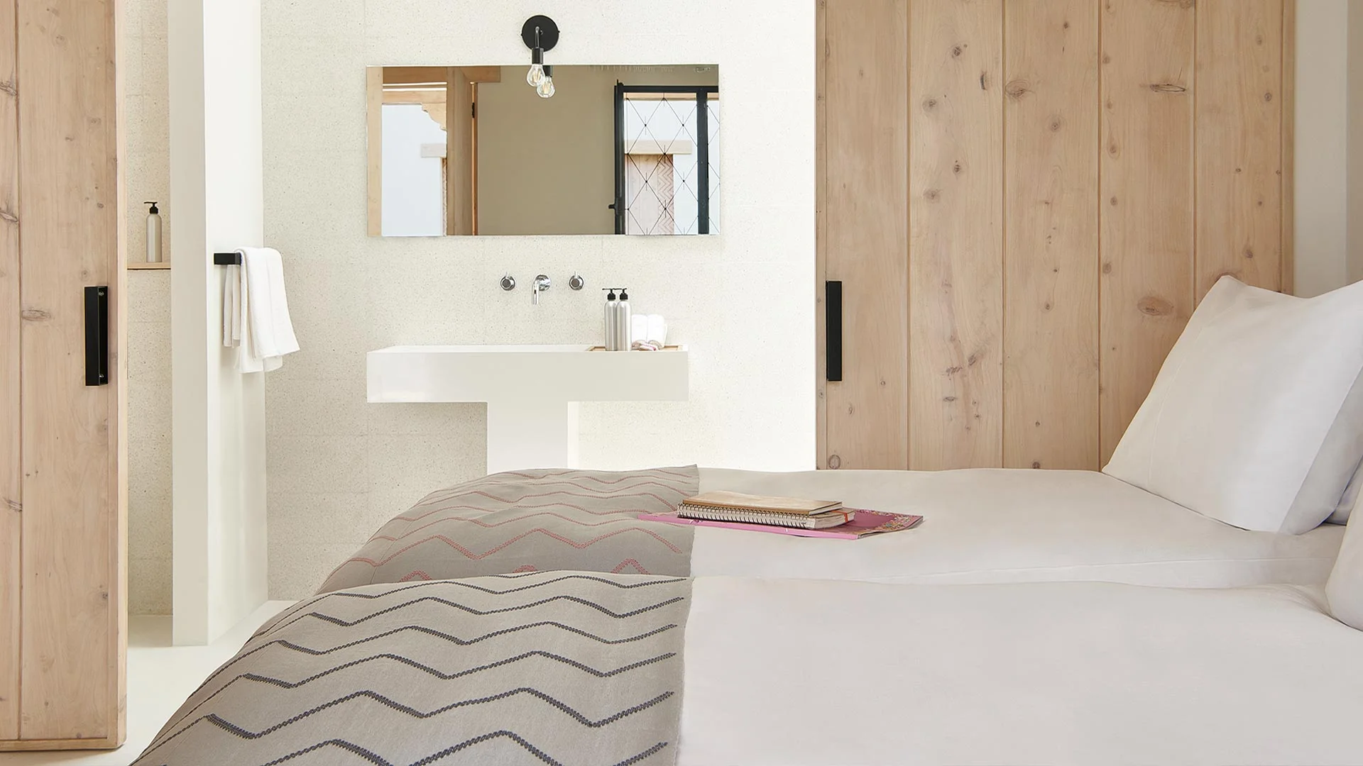 Pila Room / Sliding doors reveal the signature PILA sink. The typical T-shaped design is inspired by local washing culture that can still be found in the older homes and market squares of Antigua.