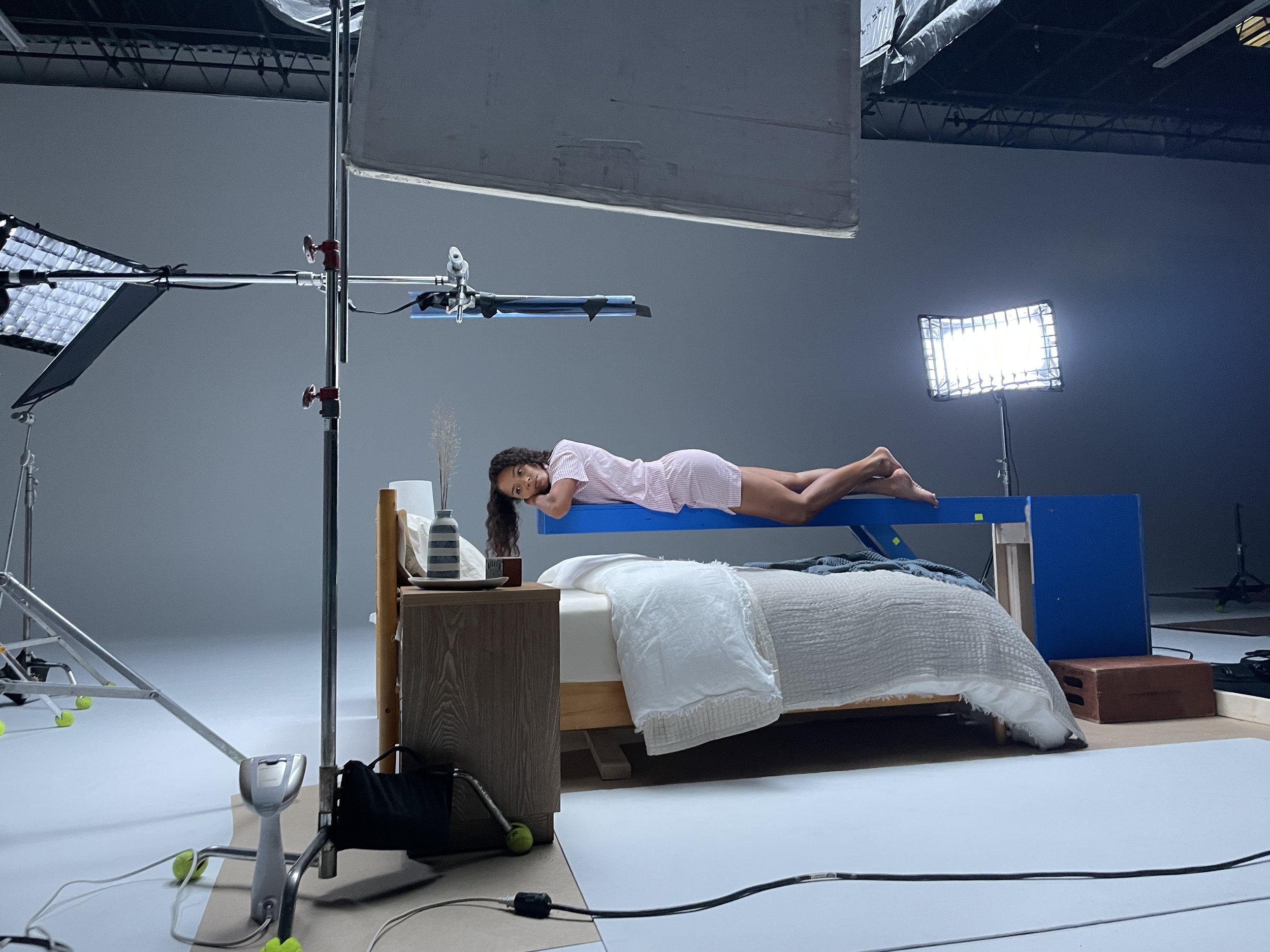 An inexpensive solution to make her float above the bed.