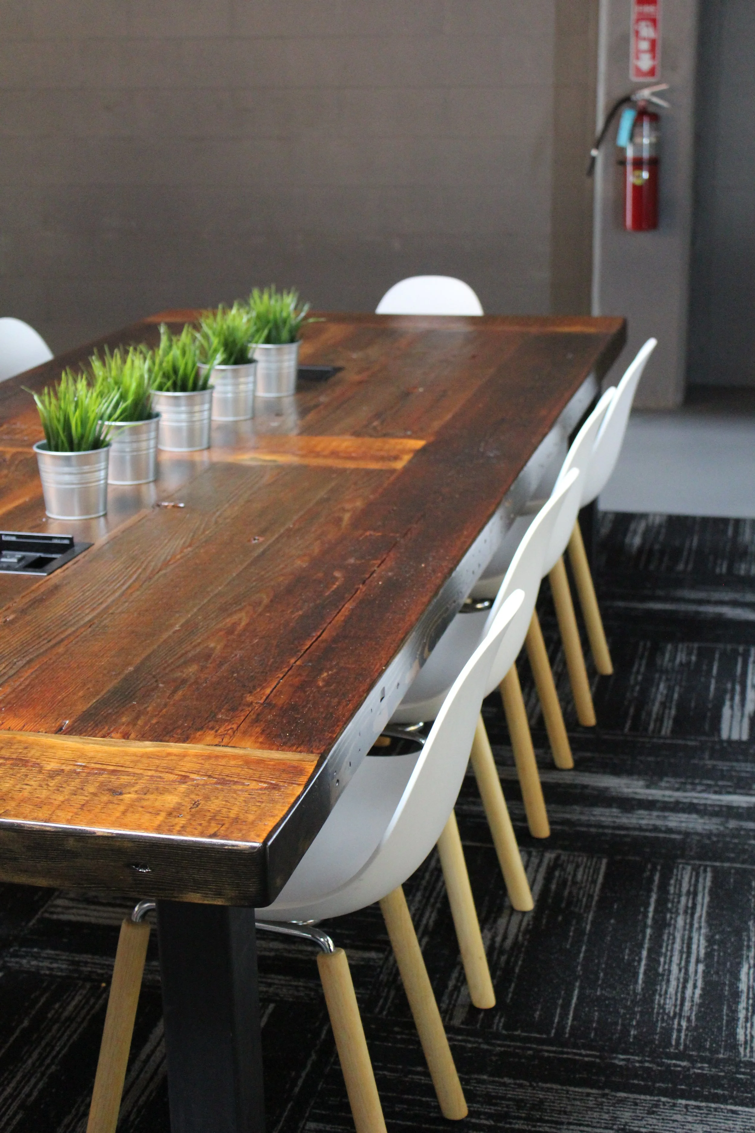 industrial style table with reclaimed wood, baltimore maryland custom woodworking metalworking, outlets and cable management, coworking table, conference table, office lounge table large