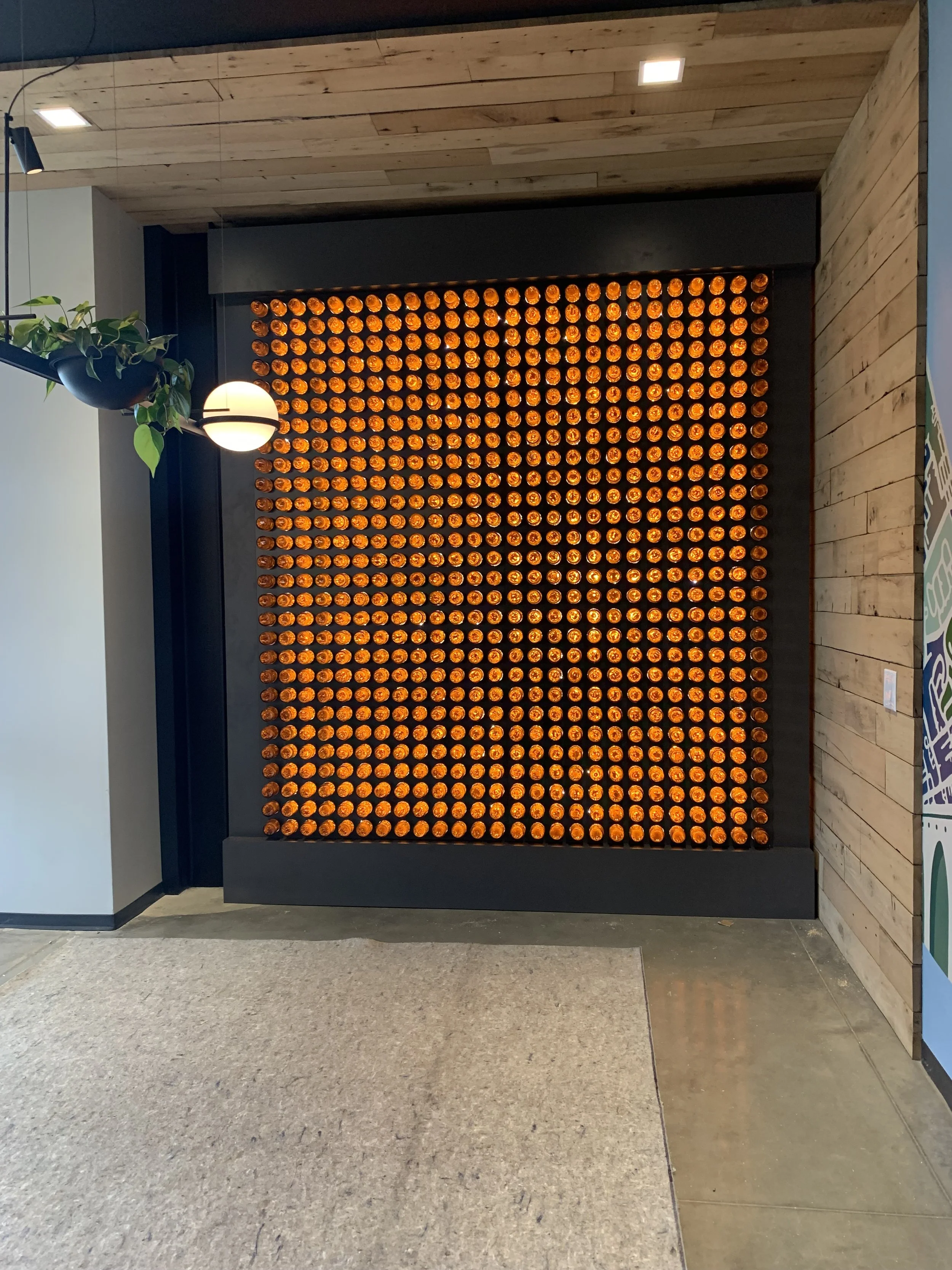 beer bottle accent wall, brewery headquarters lobby, custom woodworking baltimore maryland