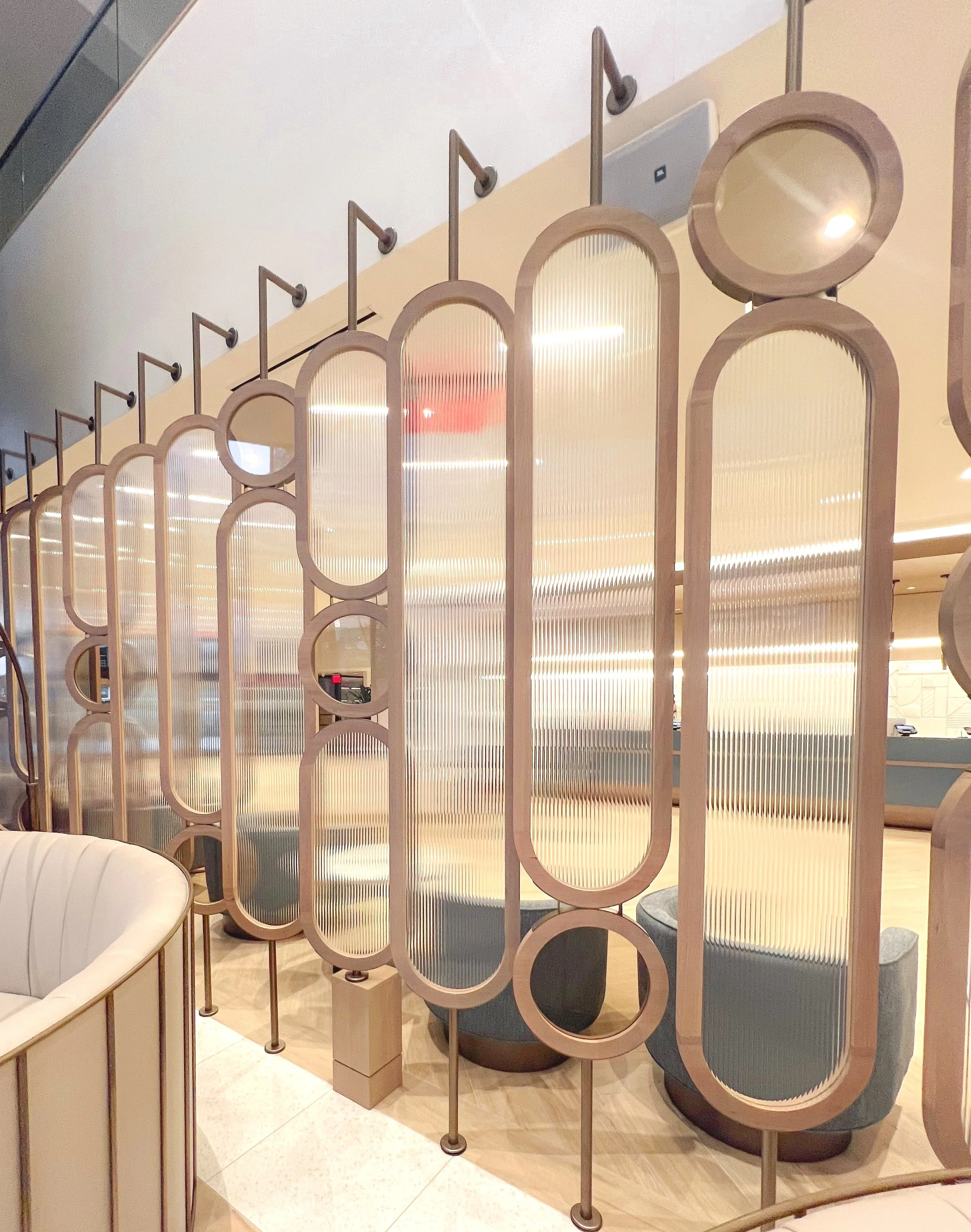 oval unique space diivder, large hotel lobby accent feature, light wood with reeded glass modern, custom woodworking custom metalworking custom furniture baltimore maryland