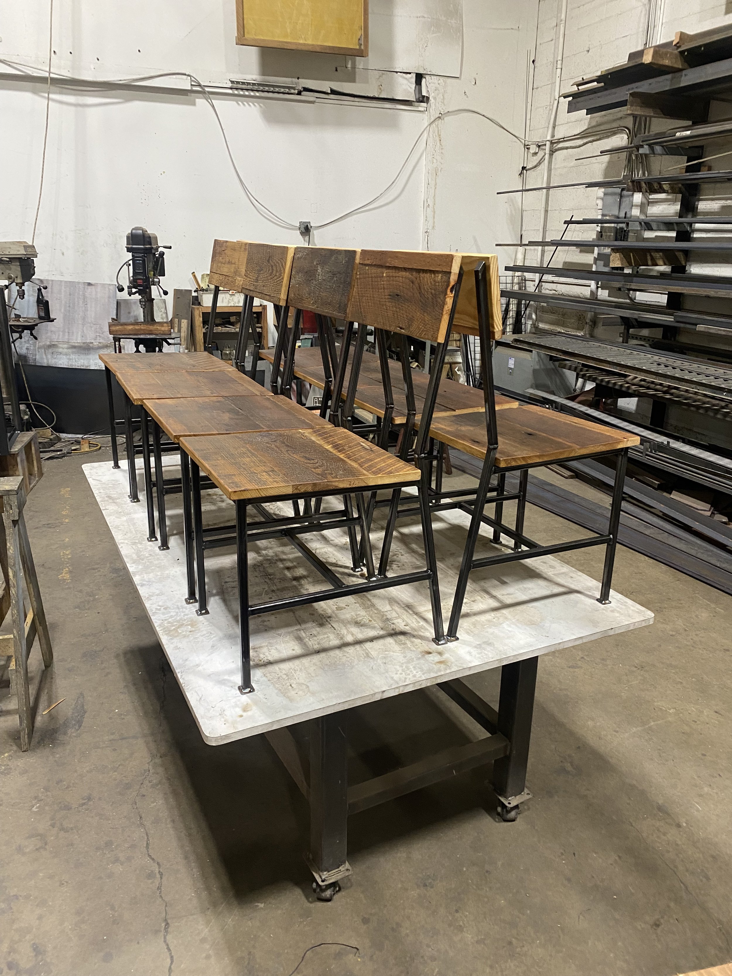 rustic reclaimed wood chiar with steel legs, farmhouse rugged industrial look, uncomfortable cafe chairs for high table turnover