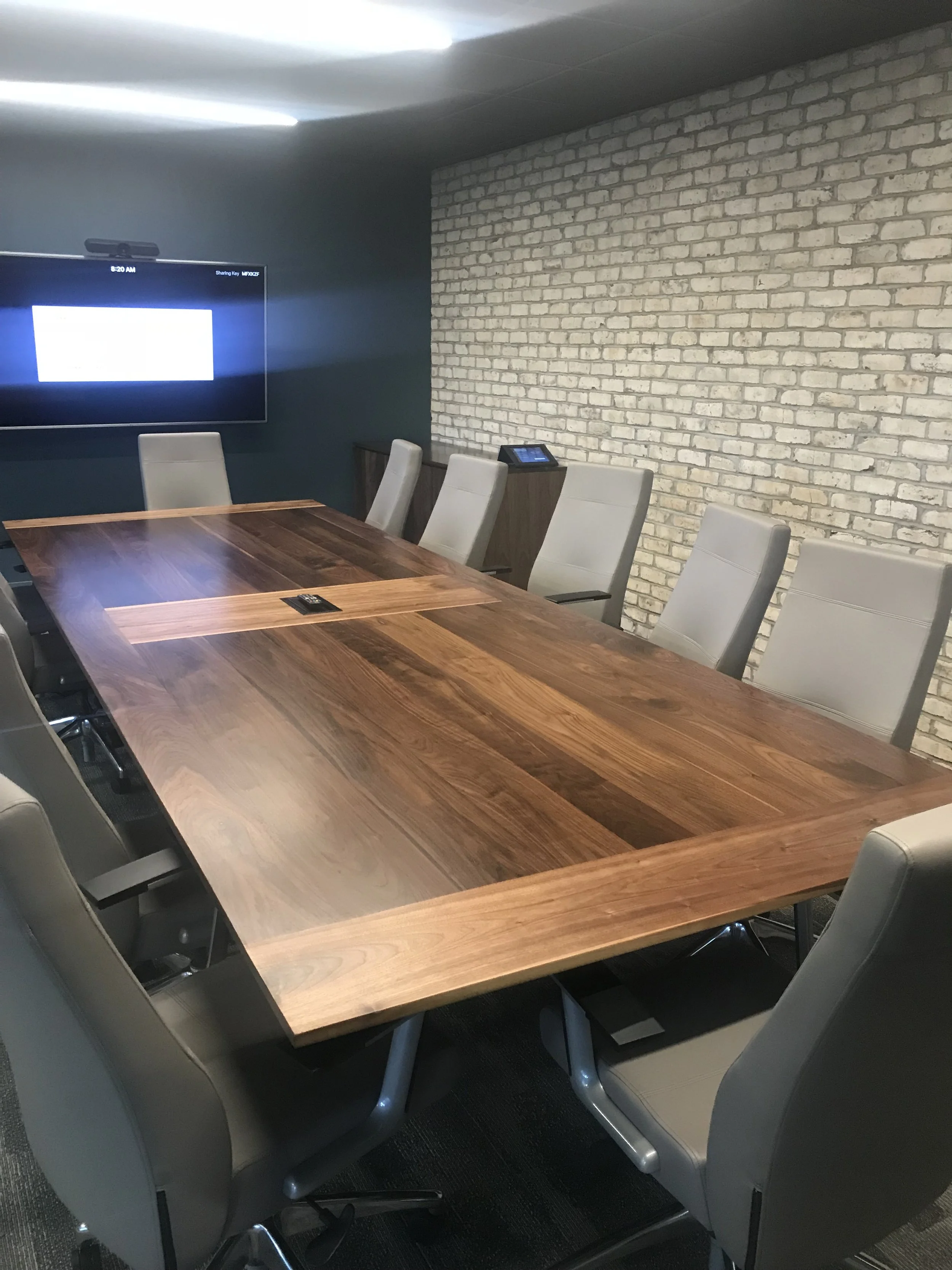walnut cinference table with breadboard ends and cable management