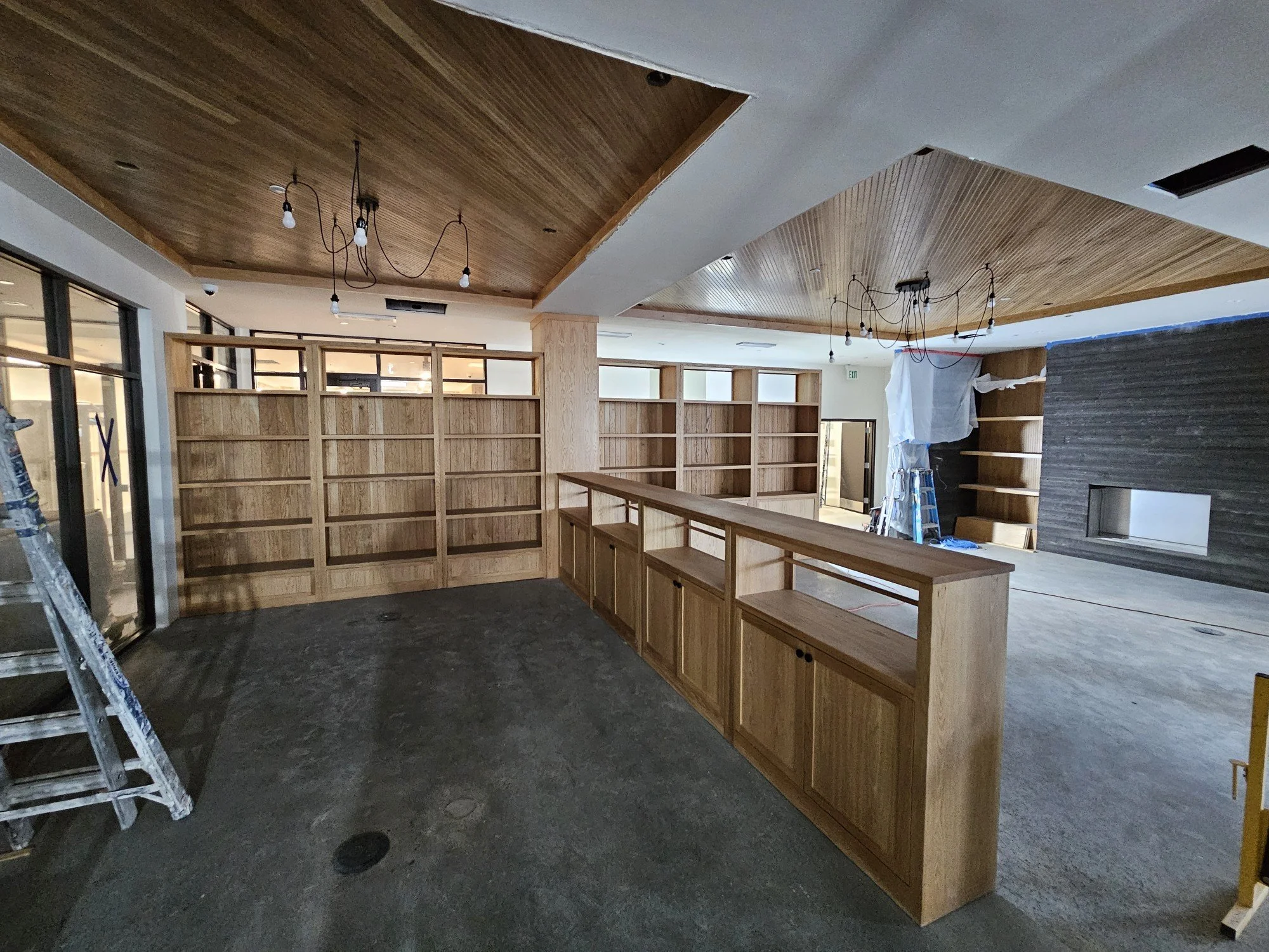modern library, warm lobby living space, custom woodwork custom metalwork baltimore maryland, white oak shelving, high end residential lobby