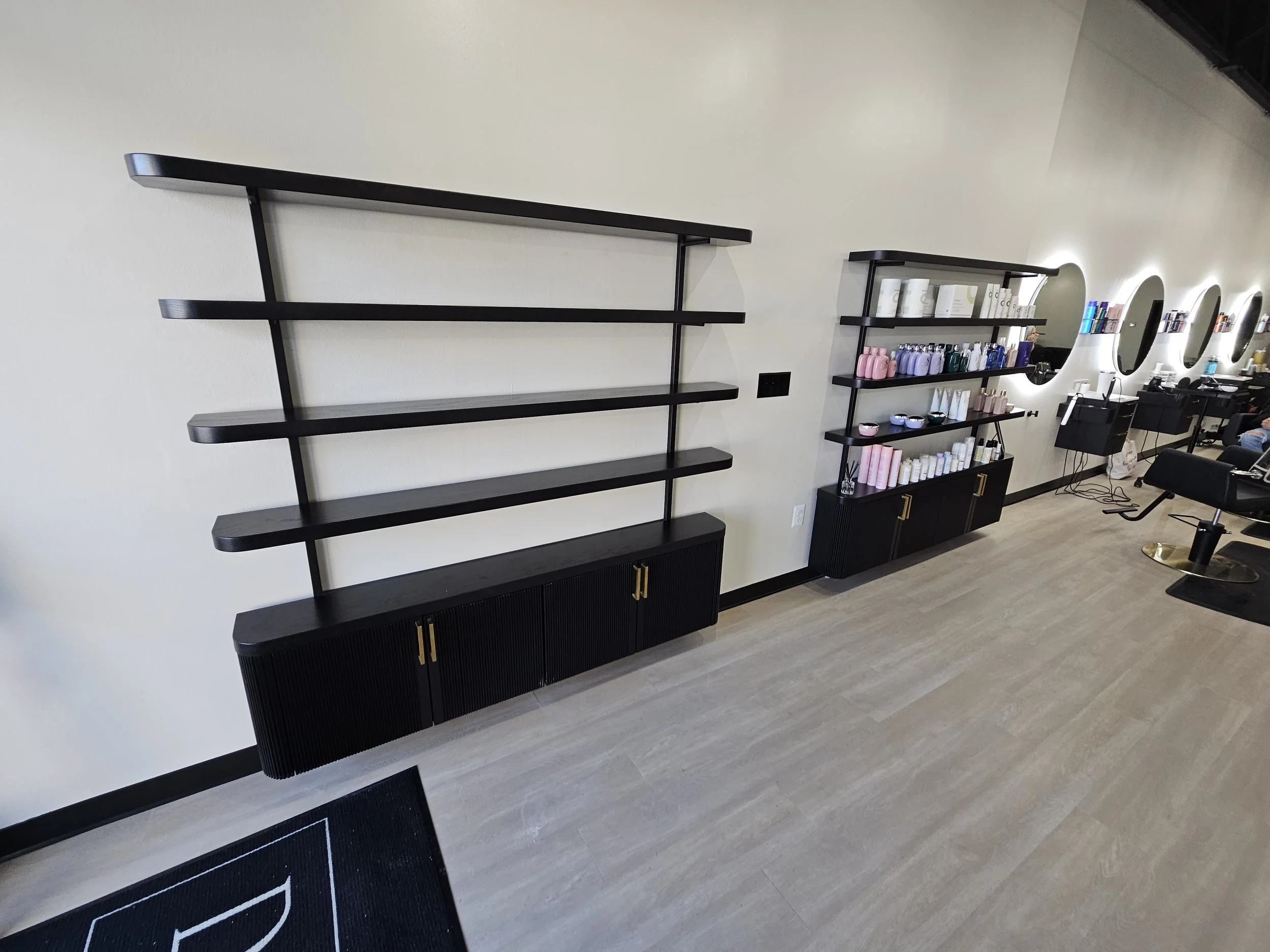 high end salon shelving cabinets, product diaplay storage salon, black and gold retail display,custom stairs baltimore maryland,