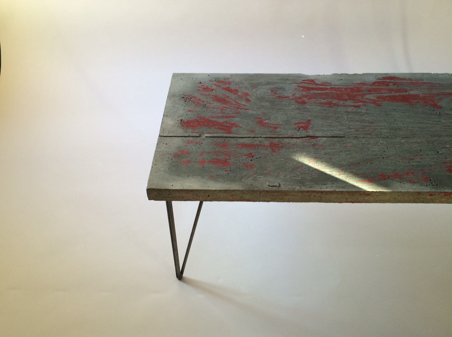 Post Punk | Modern An old graffitied wall. Urban development | Urban decay. The promise of inevitability on the surface of a table built in an attempt to withstand time.