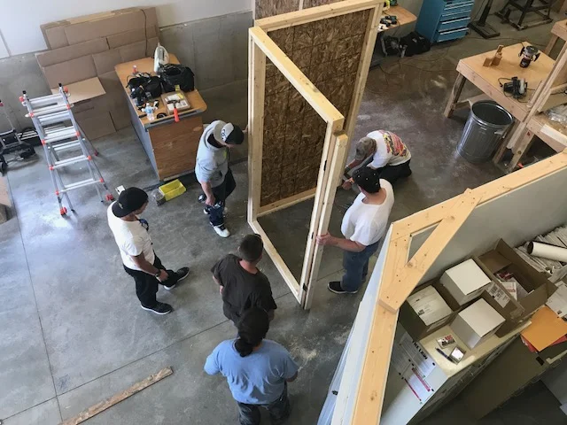 Cole, Anderson, Nick, Sena, Paul and dan building the wall