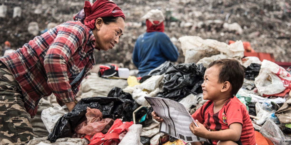 Andi, only a few years old, plays amongst the mounds of rubbish as his mother sifts through to salvage what she can.Andi, only a few years old, plays amongst the mounds of rubbish as his mother sifts through to salvage what she can.