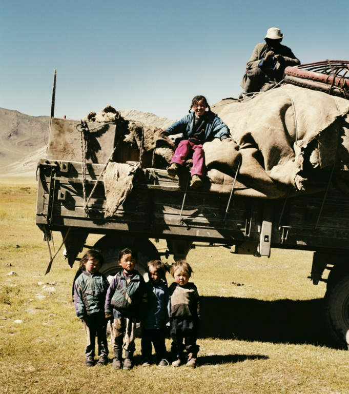 A herder, his wife, and their five young children make their way to winter pastures, transporting their “ger” or yurt and all their belongings.