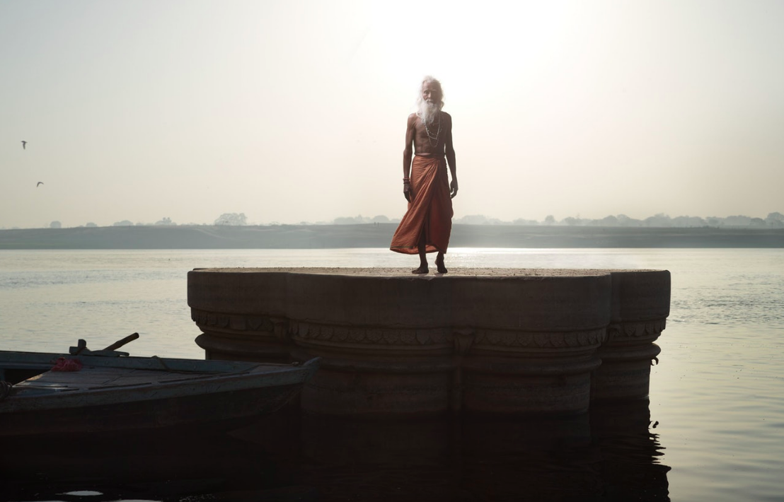 Above: Shiv Ji Tiwari stands on a sunken temple in Varanasi. 
