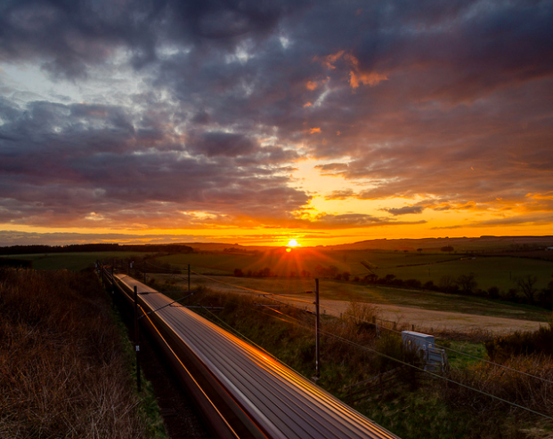 Traveling by train is a great way to reduce your carbon footprint and see more of the place you are traveling through. Image Credit: Jonathan Combe. CC BY 2.0