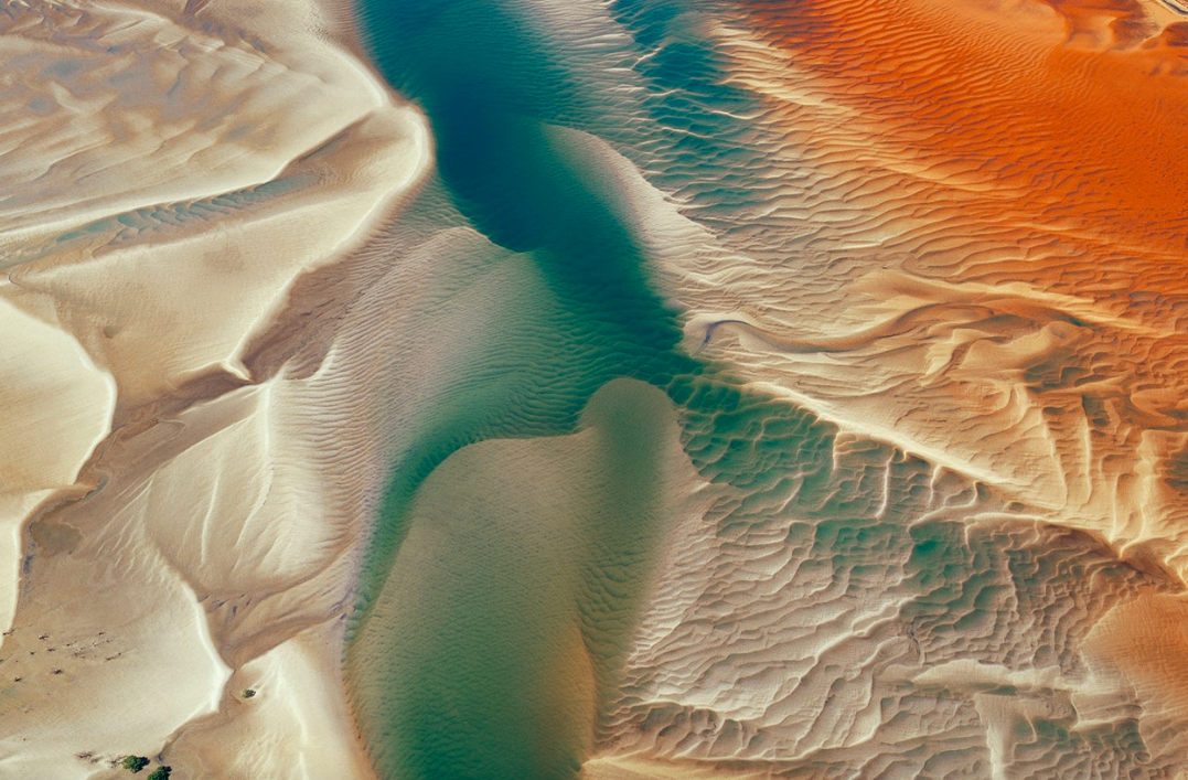 Top of Curtis Island, Cape Capricorn, north-east of Gladstone, Queensland. An estuary with sand banks. (Taken 1997)