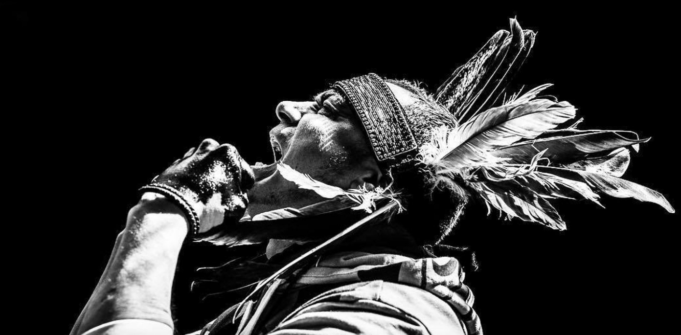 Wearing his people’s traditional headdress, Will George, of the Tsleil-Waututh First Nation, screams out his frustration at the Canadian government for allowing the expansion of another destructive oil pipeline across his people’s ancestral lands.