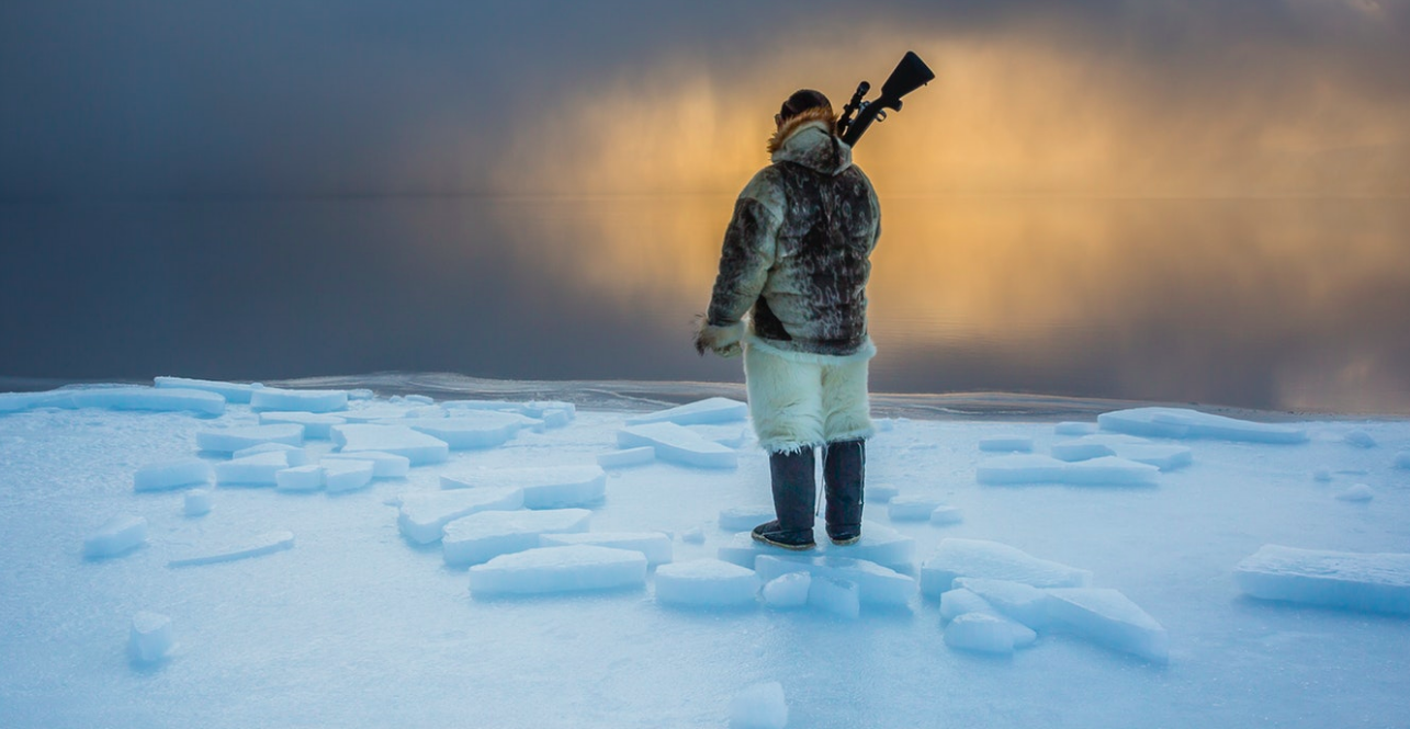 I watched as the sun dipped below the horizon, and the molten gold of sunset saturated the twilight. Just as his ancestors have done for centuries before him, Naimanngitsoq Kristiansen waits patiently for harp seal or walrus at the ice edge. Greenland